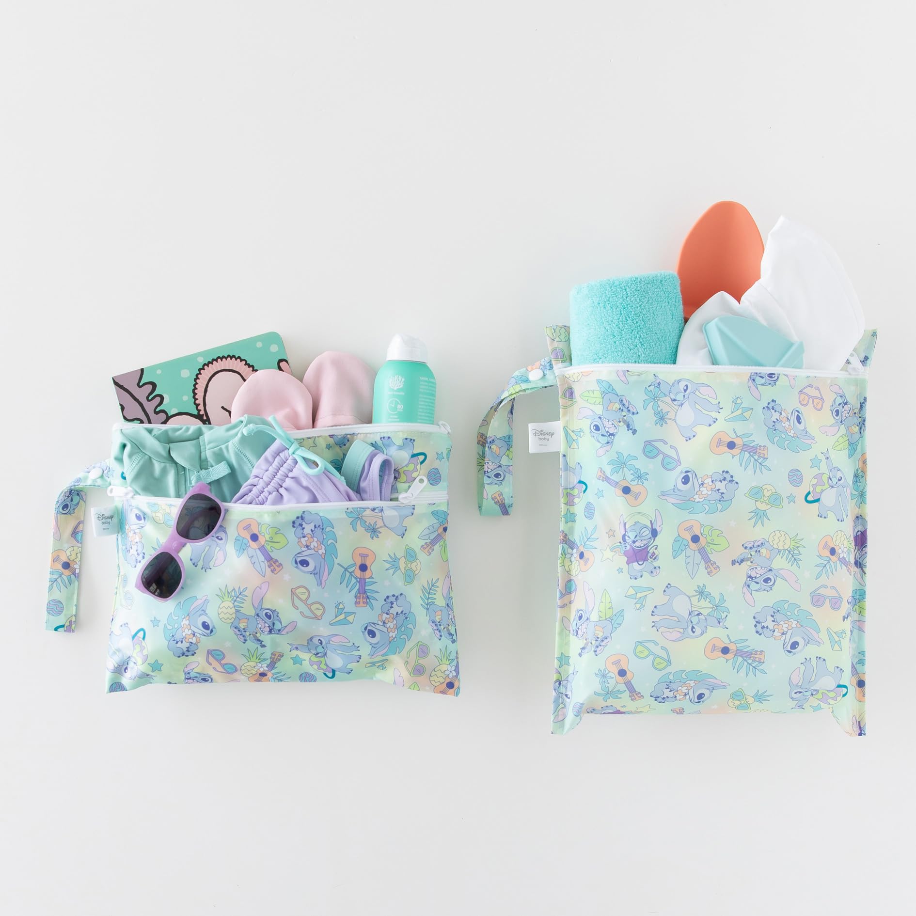 Bumkins wet bag attached to stroller with snap handle for on-the-go.
