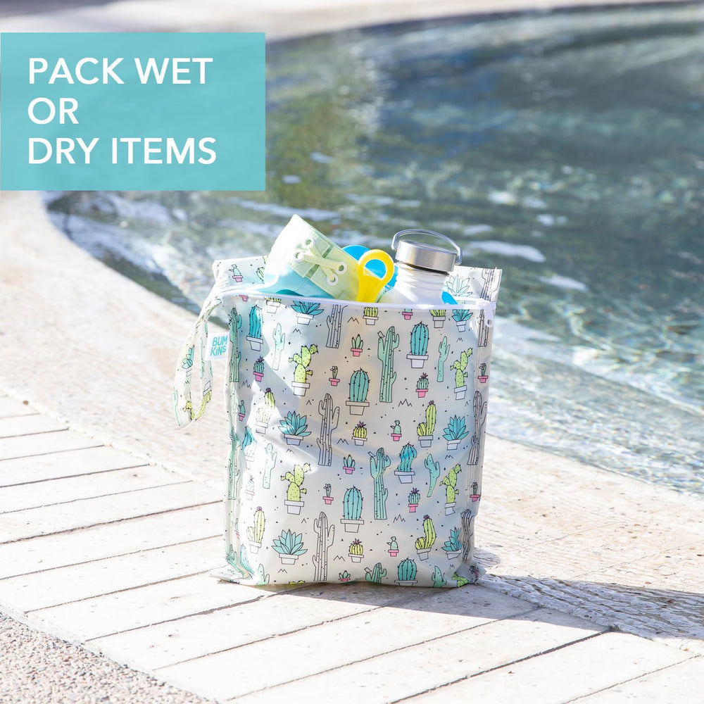 Bumkins wet bag stroller clip use demonstrates hands-free travel attachment.