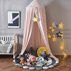 Bunnikins & Clover bed canopy creates a private play space above a mat.