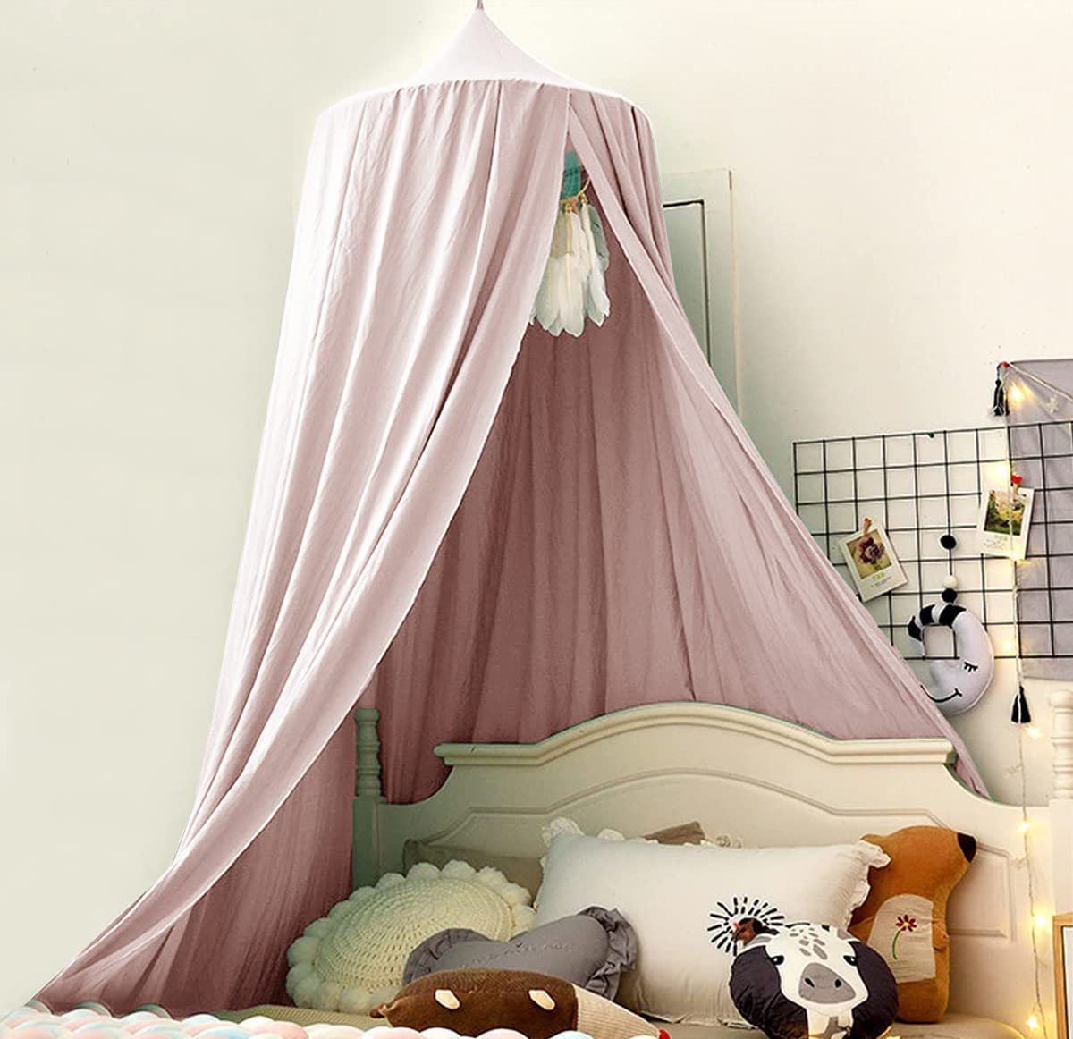 Bunnikins & Clover bed canopy round dome mosquito net keeps bugs out while framing a cozy sleep space.