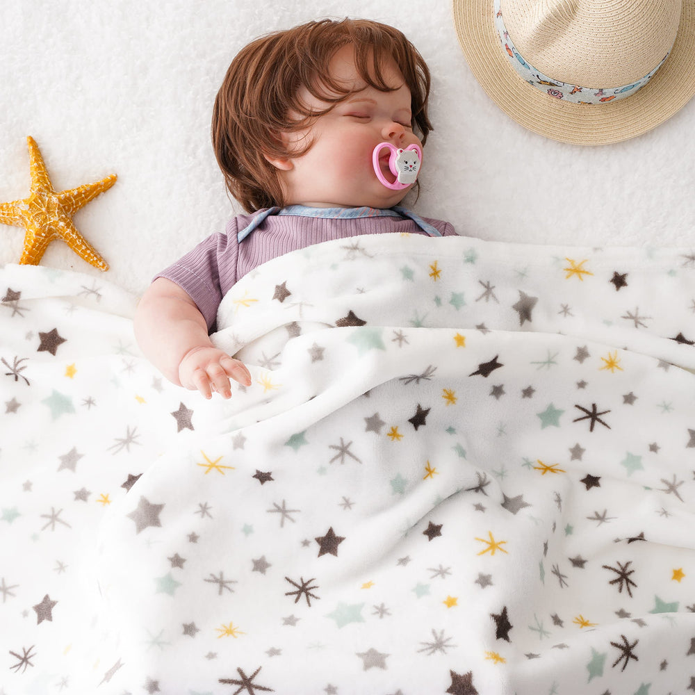 Bunnikins and Clover crib-use scene highlights safe, lightweight warmth for newborns.