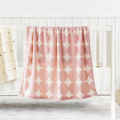Bunnikins & Clover folded travel blanket — compact and easy to carry.