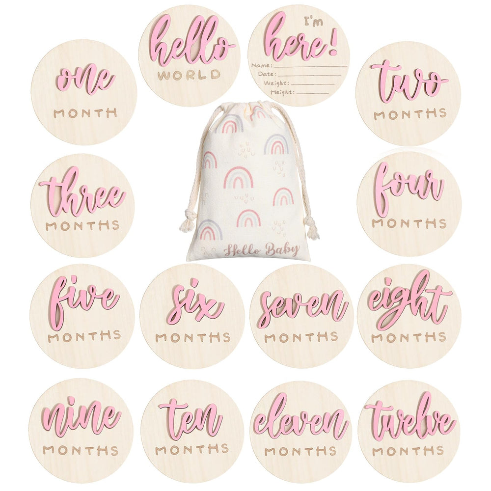 Burbell 7-pack pink milestone discs capture baby's growth milestones in photos.
