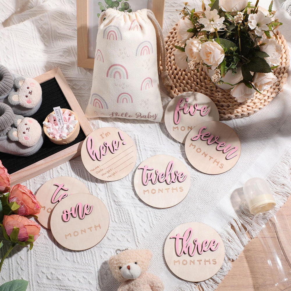 Burbell hello world double-sided discs display key milestones for versatile newborn photo setups.