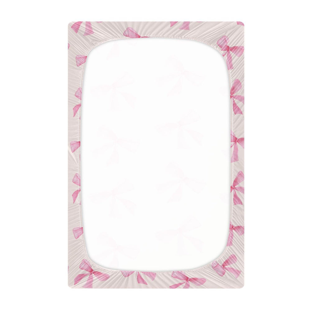 Burbuja Pink Bow crib sheet with elastic band secure fit around mattress