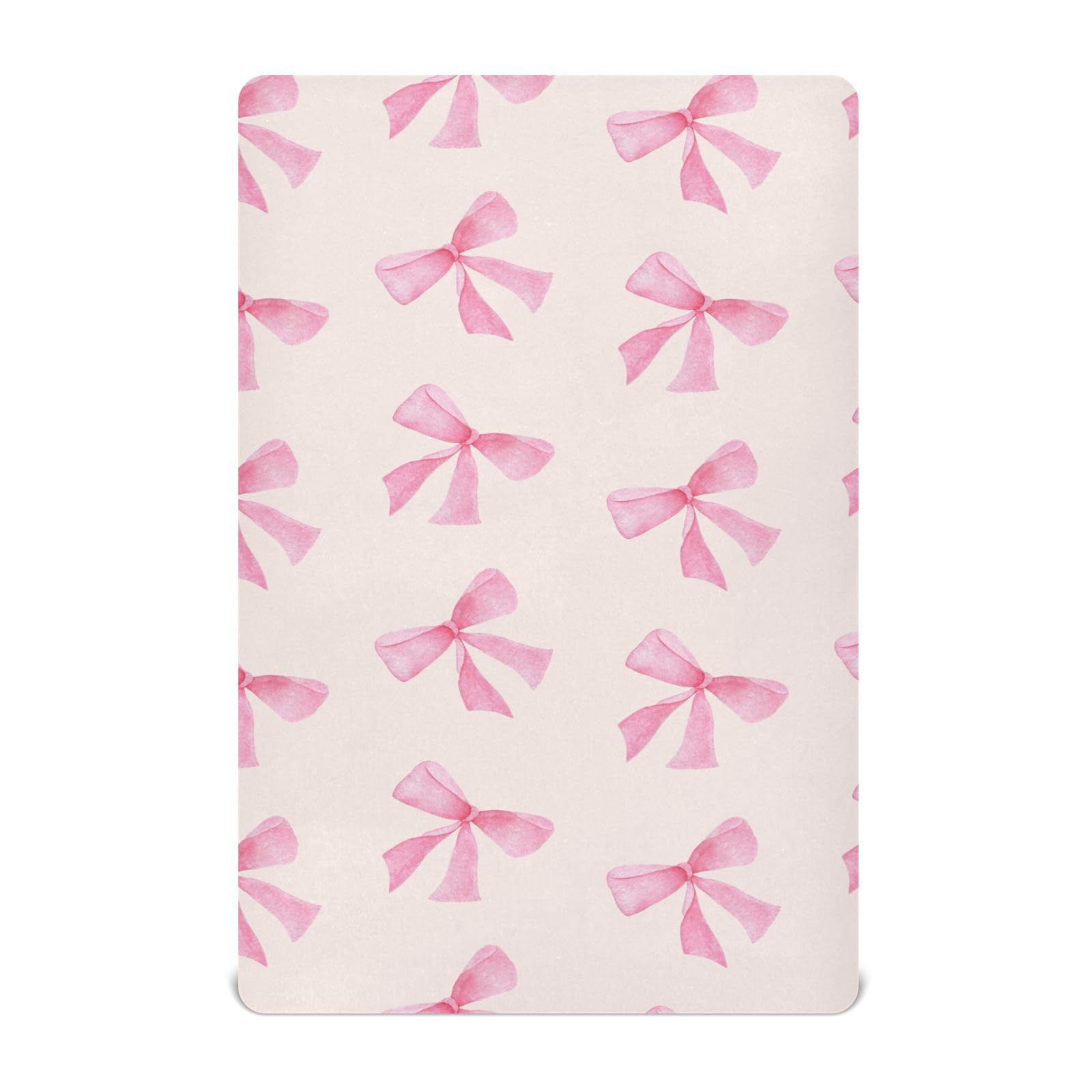 Burbuja Pink Bow crib sheet close-up shows soft modal fabric for gentle touch