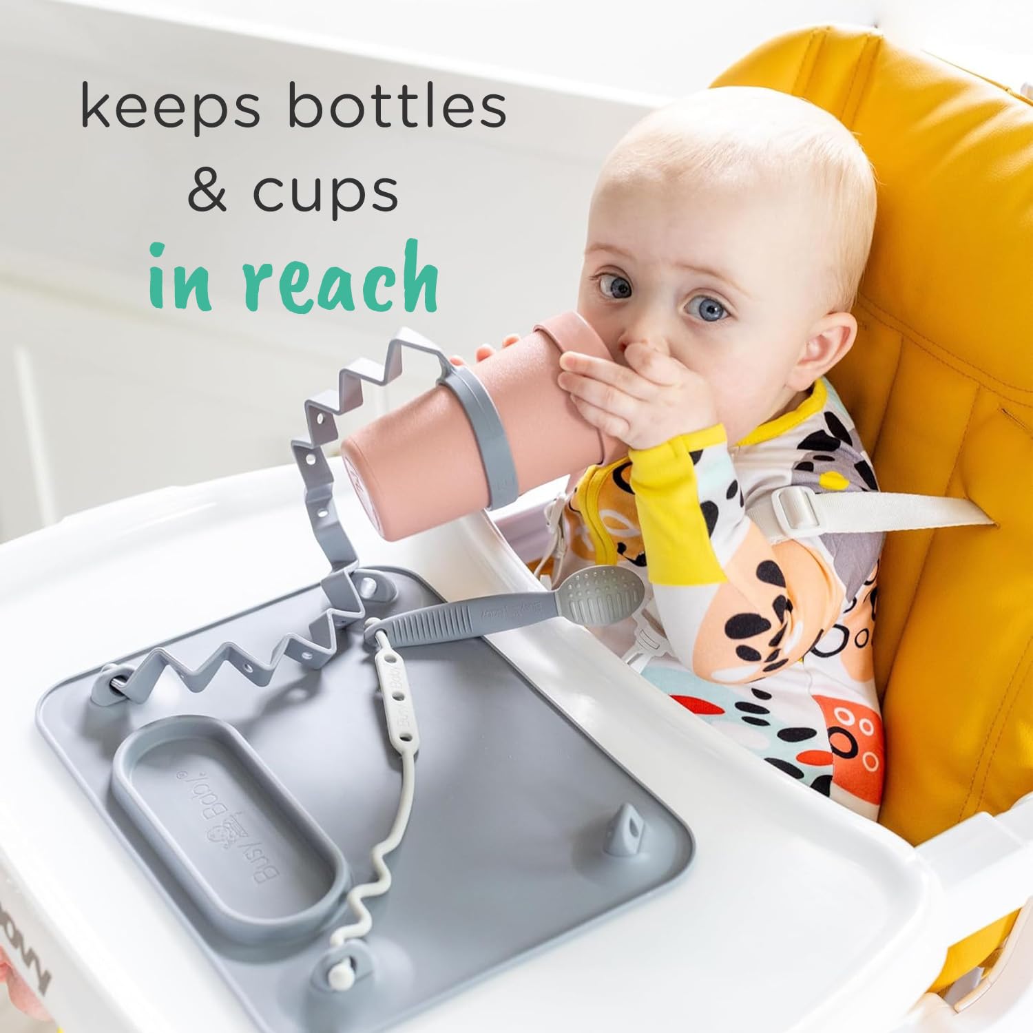 Busy Baby Bottle Bungee pink wrap-around bottle for secure grip during play.