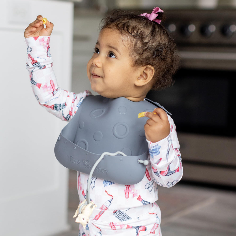 BUSY BABY Bungee Bib tethers adjustable features keep toys within reach.