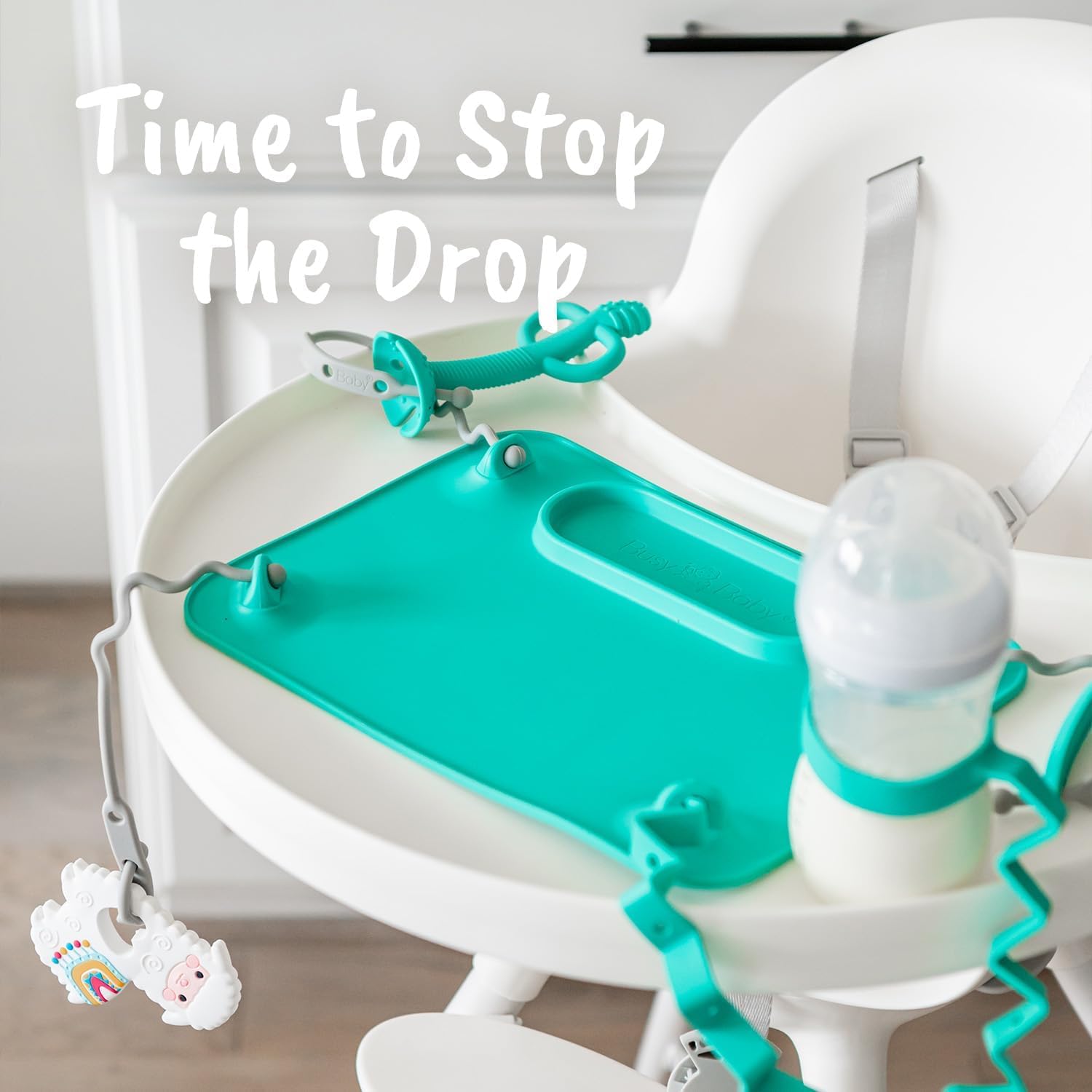 Busy Baby teething spoon attachment hole demonstrates compatibility with Busy Baby tether.