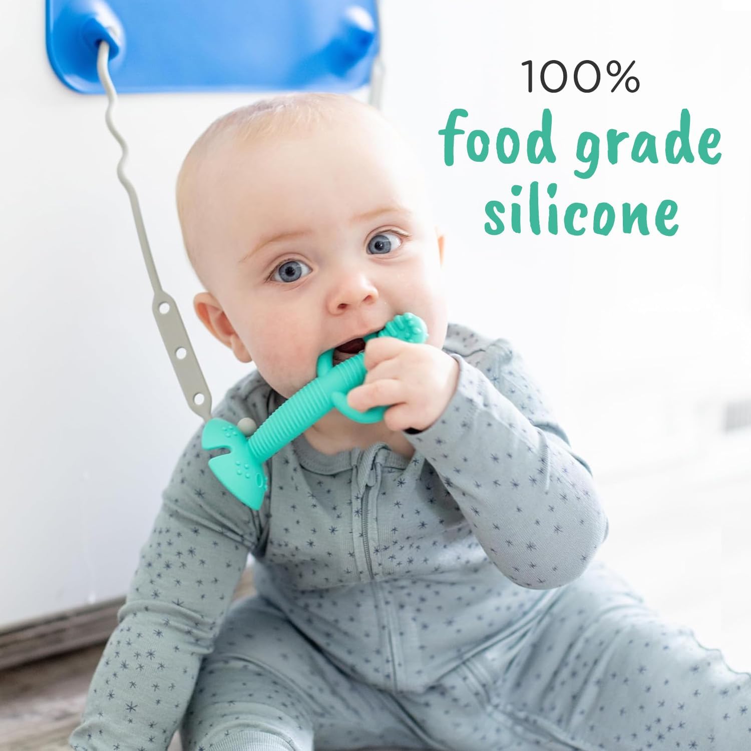 Busy Baby teething spoon with textured handle demonstrates easy self-feeding grip.