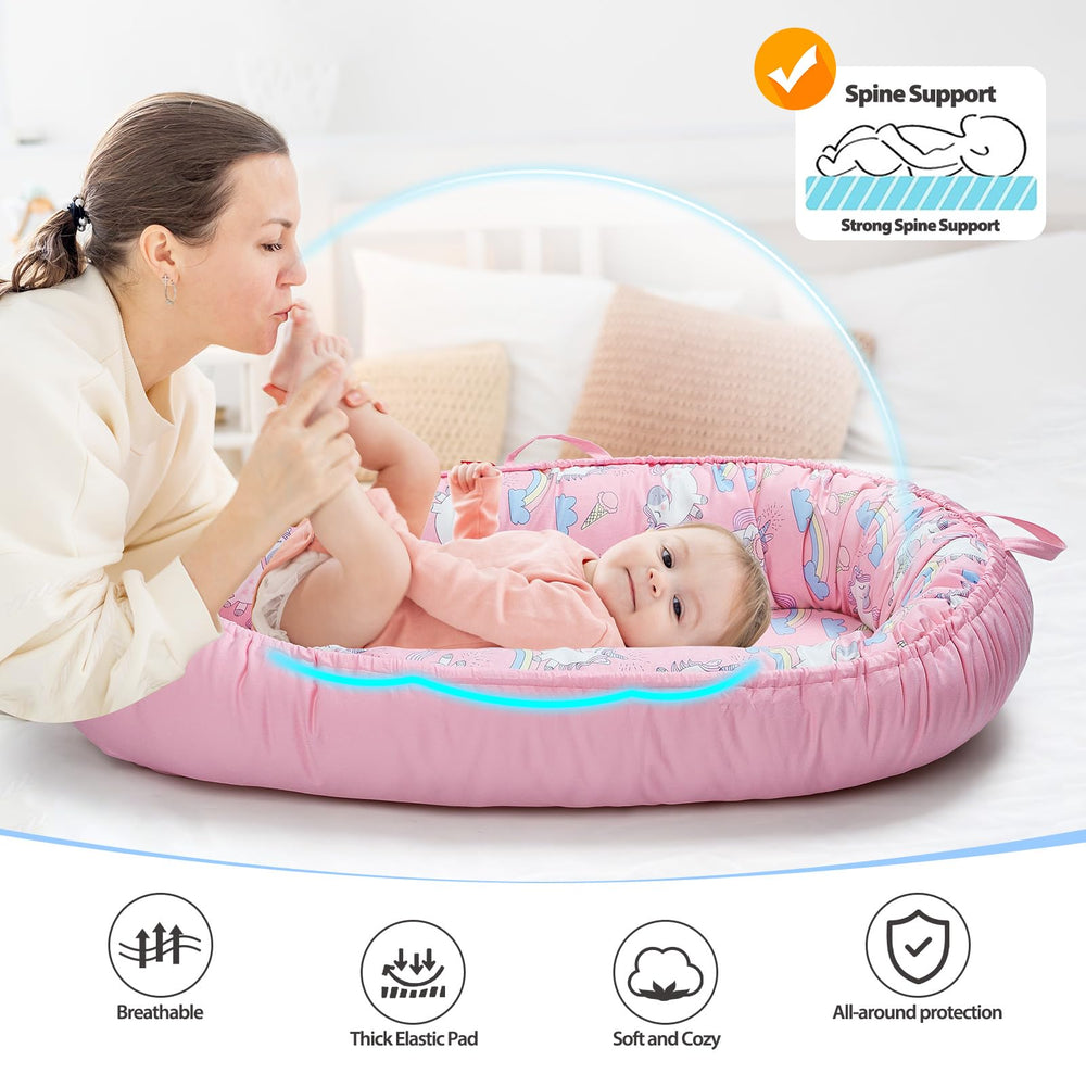 BUTOA Baby Lounger with handles shows portability for home or travel.