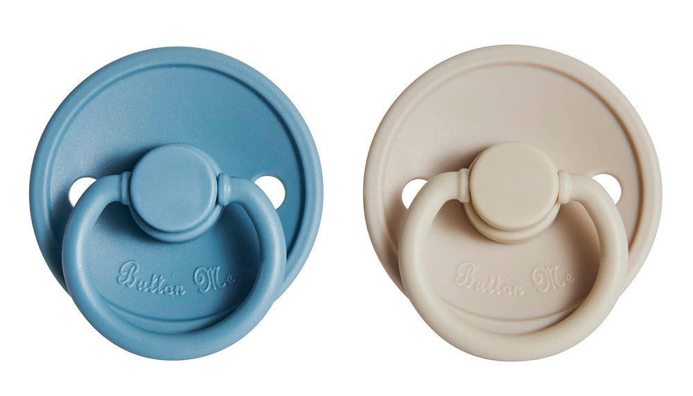 Button Me pacifier nipple closeup in soft silicone highlights a gentle, realistic shape for calming comfort.