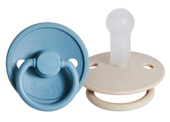 Button Me premium soft silicone pacifier 2-pack packaging demonstrates durable soothing design.