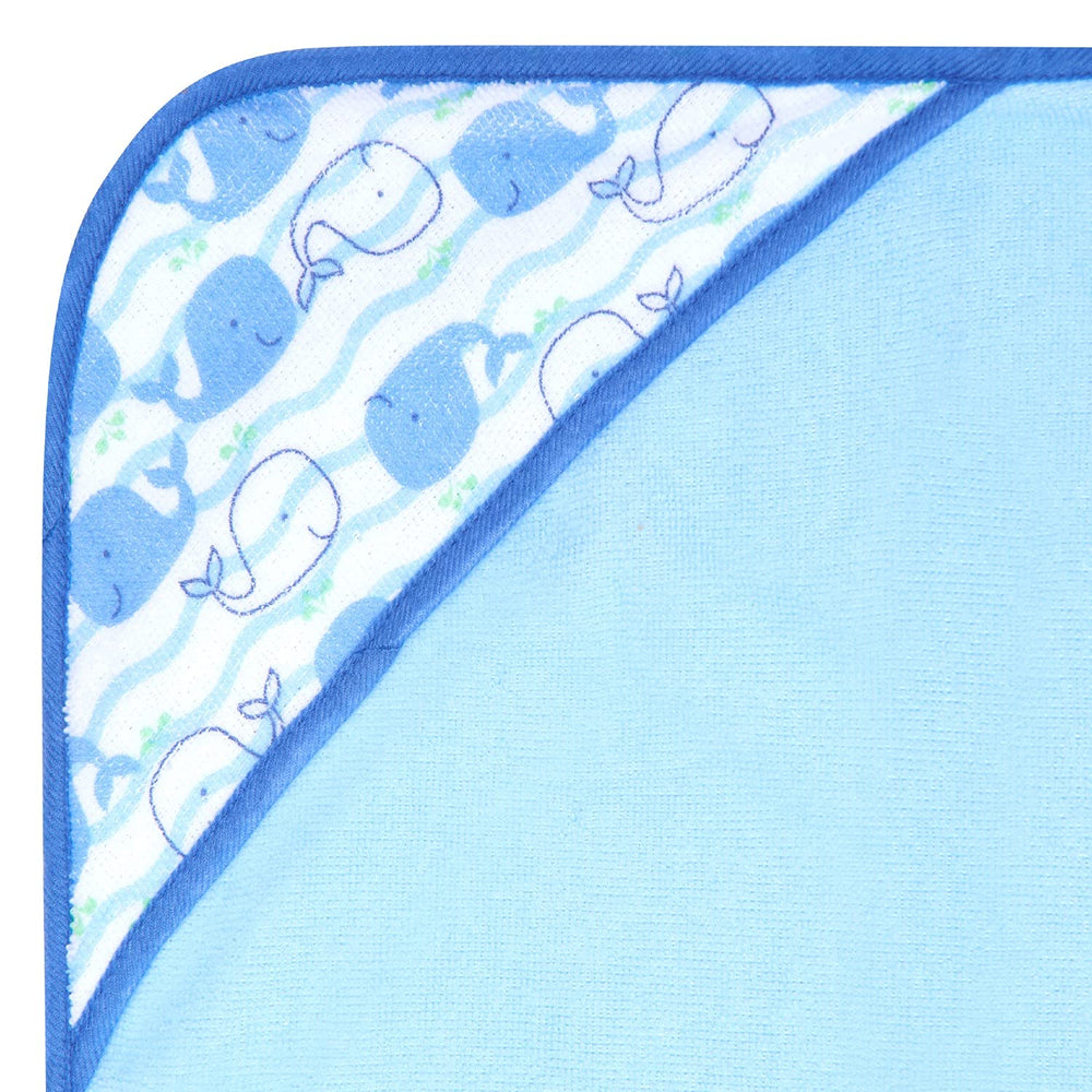 Buttons & Stitches Blue Whale hooded towels 26x30 inches label, roomy wrap for infants.