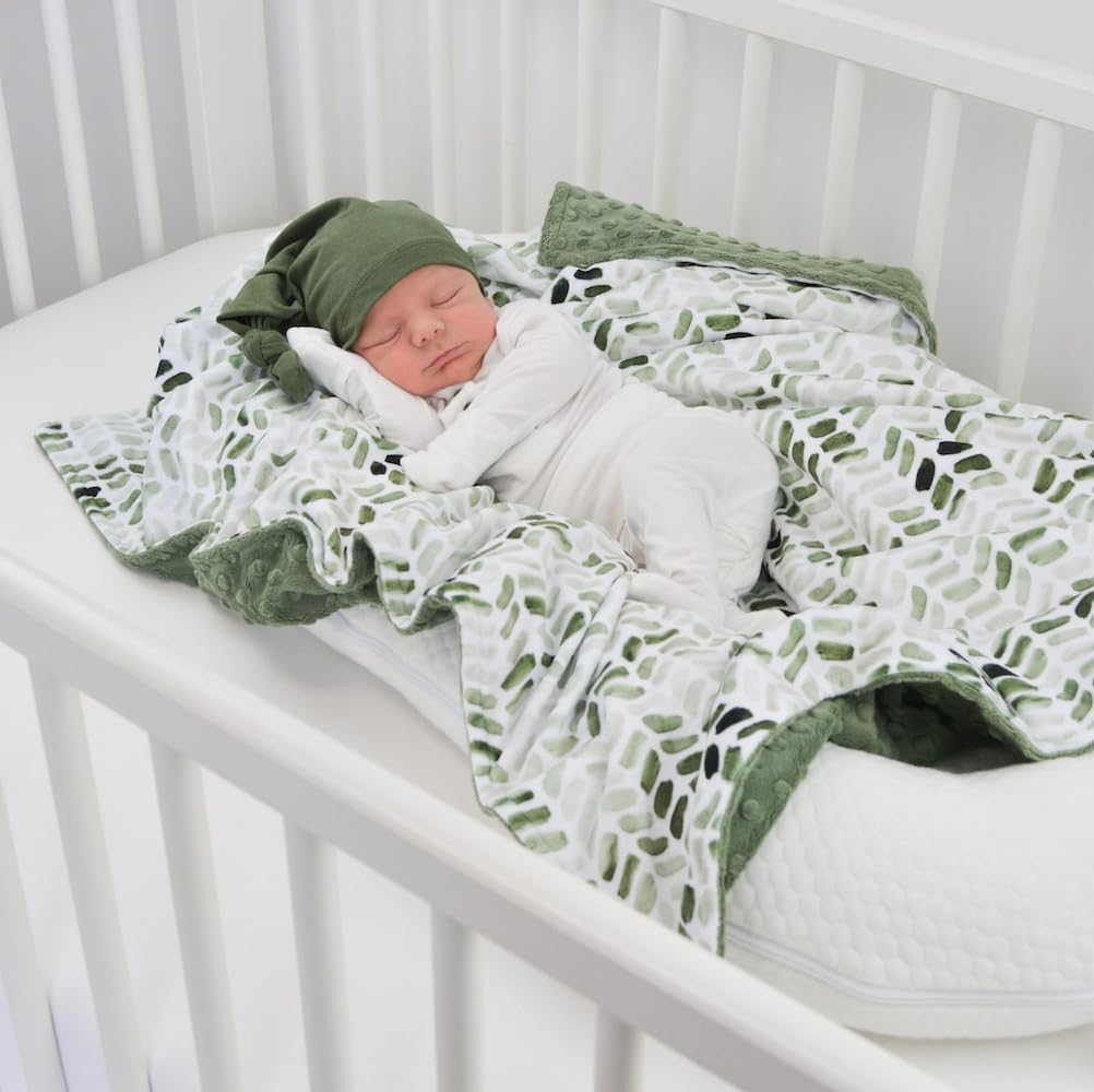 BUTTZO blanket dotted backing demonstrates added warmth and playful texture for newborn comfort