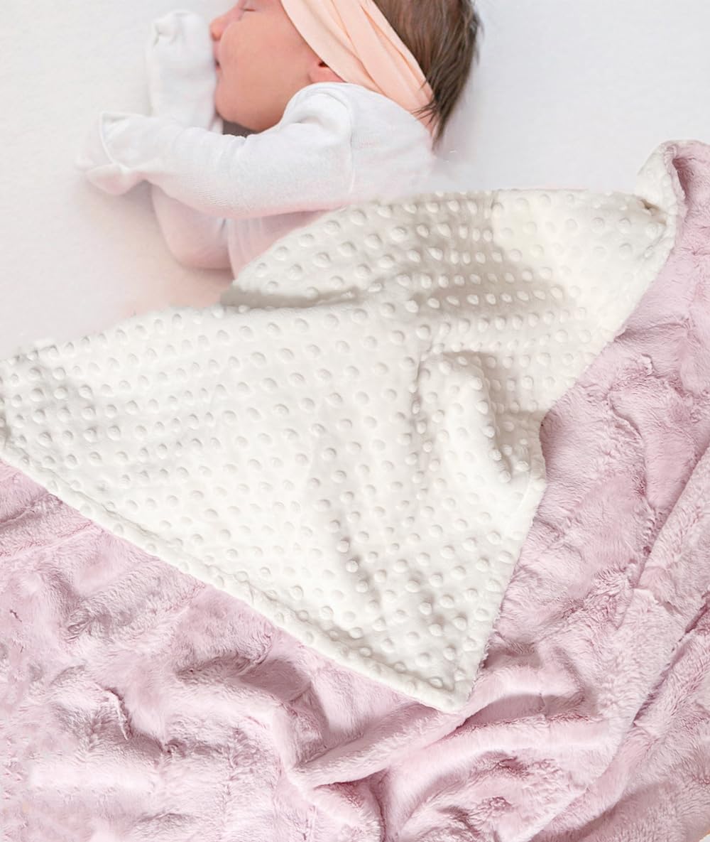 Buttzo baby blanket soft fabric close-up highlights gentle touch for baby's skin.