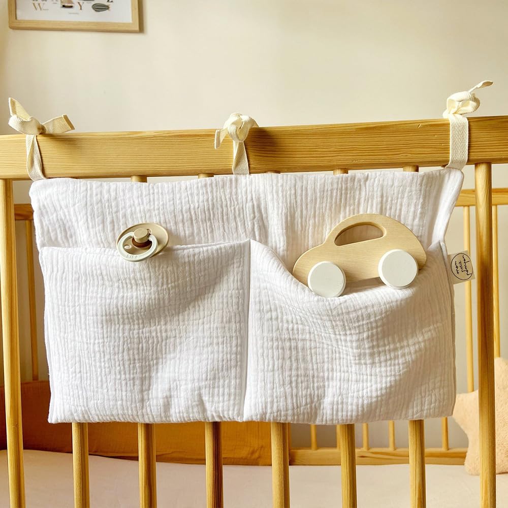 BxuanW adjustable-strap crib pocket keeps toys and books organized