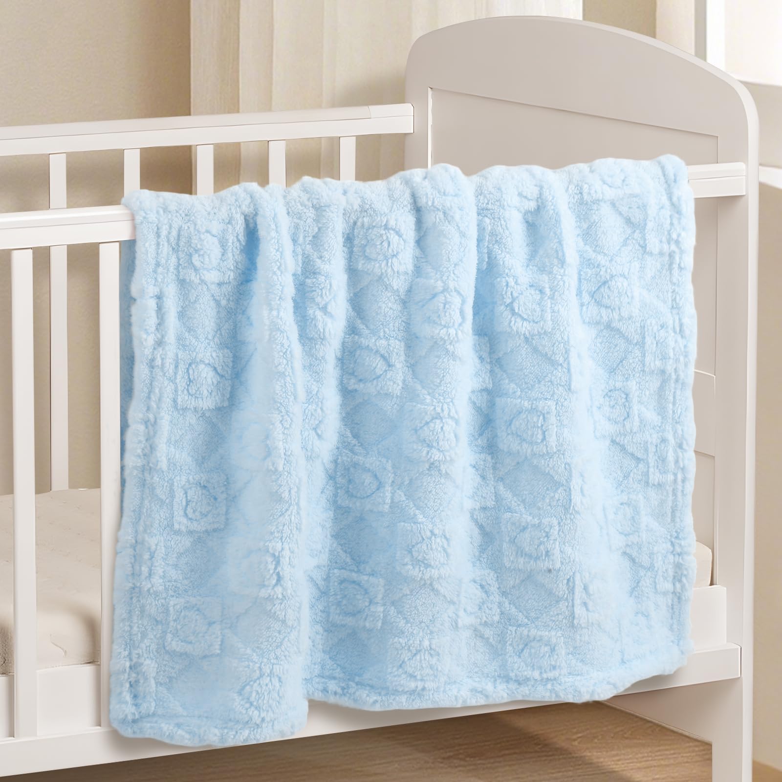 BYKOSY baby blanket draped in crib showing versatile use in blue nursery tones
