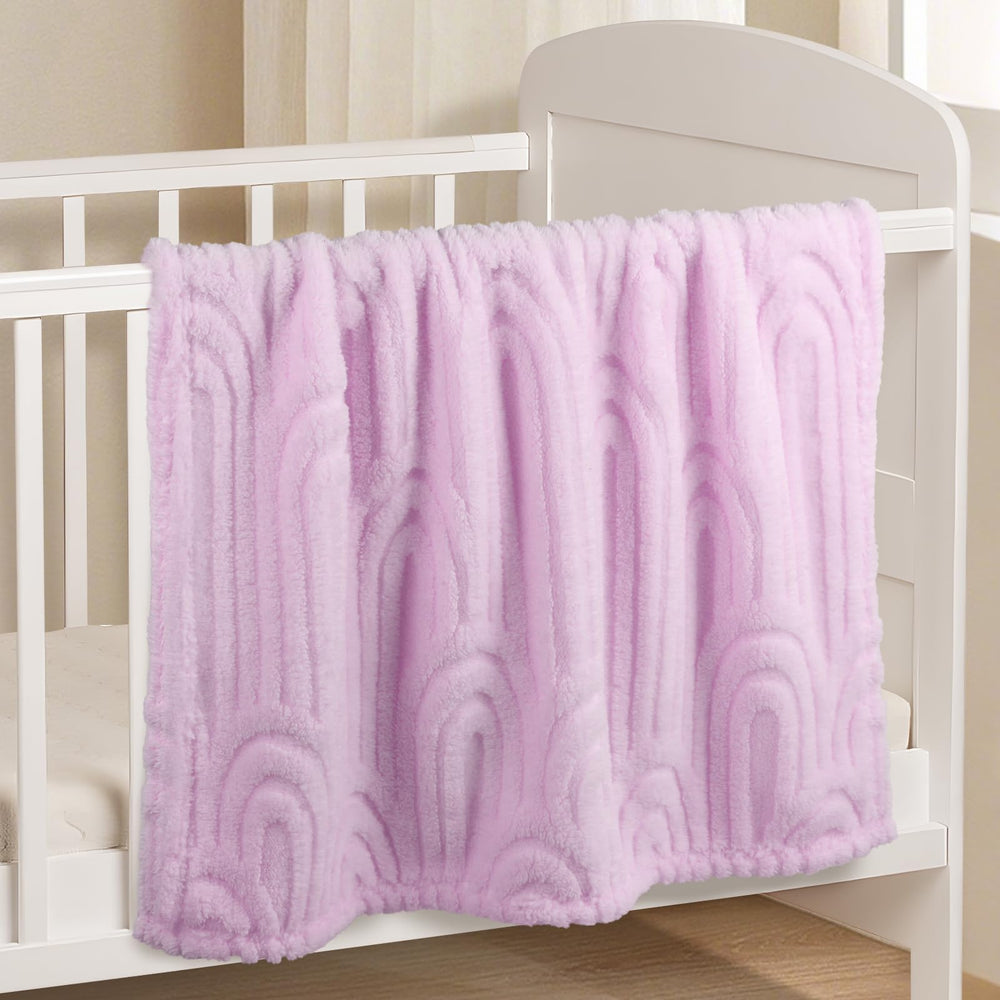 BYKOSY Rainbow blanket in crib display showing soft plush fabric.