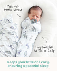 Caden Lane blanket displays solids and prints options to match nursery decor.