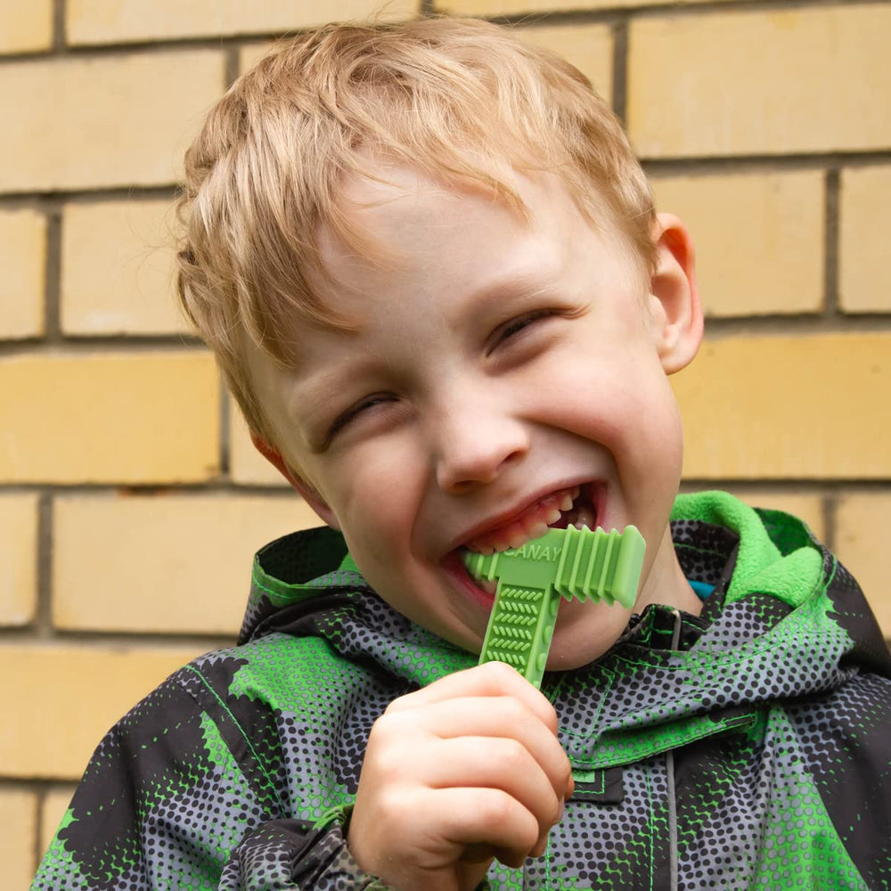 CANAY Xtra Tough Sensory Chew Bricks kid-holding action highlights durable design for aggressive chewers