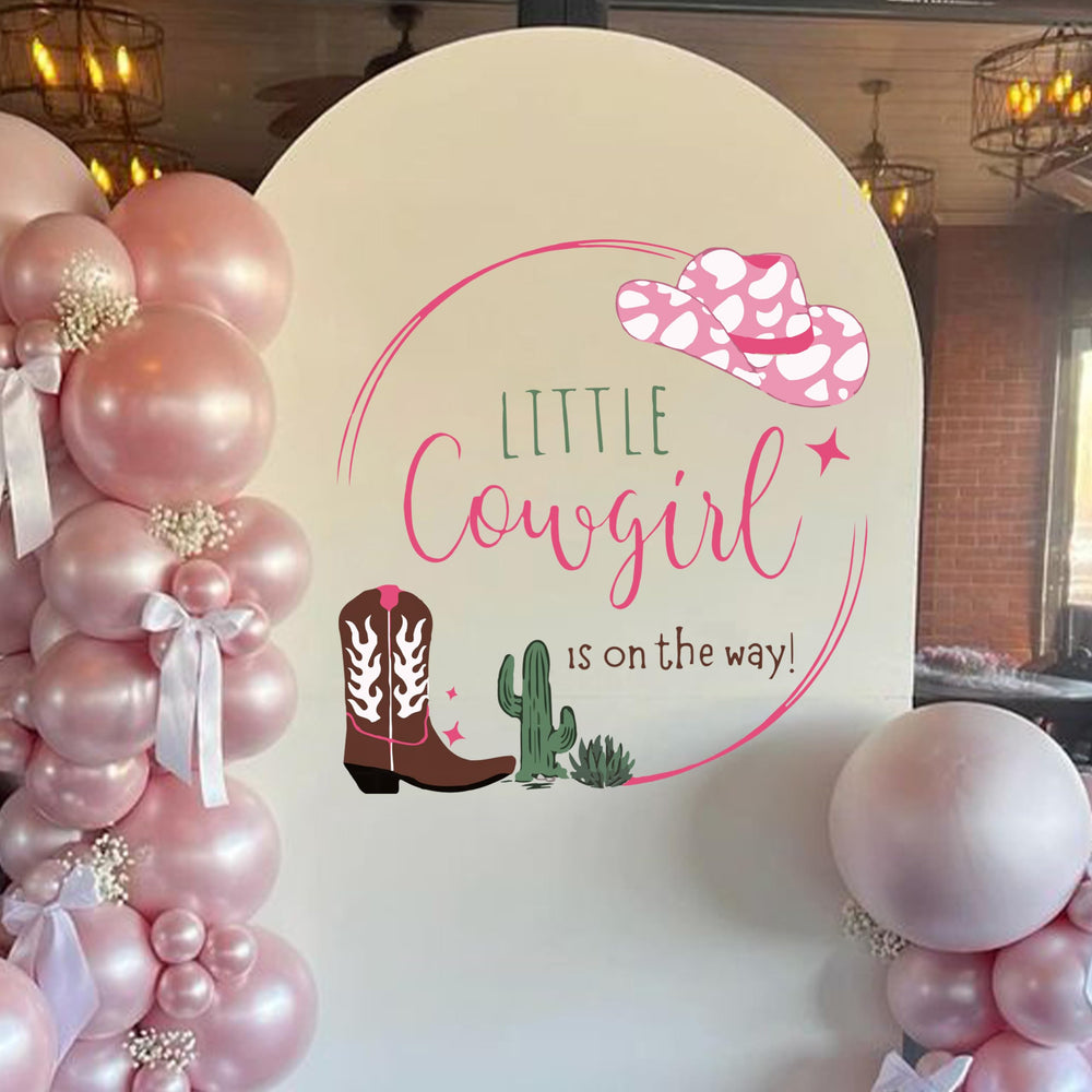 Capiont Caption A Little Cowgirl wall decal creates a bold gender reveal backdrop.