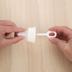 Caralin long-handle nipple brush provides easy reach for thorough cleaning.