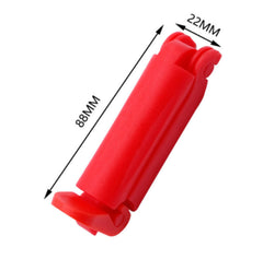 car seat belt clip red in-use on stroller demonstrates versatility