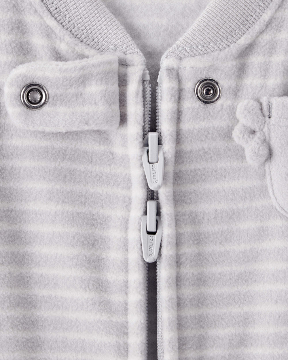 Carter's sleep bag fabric close-up shows soft, cozy polyester for gentle naps.