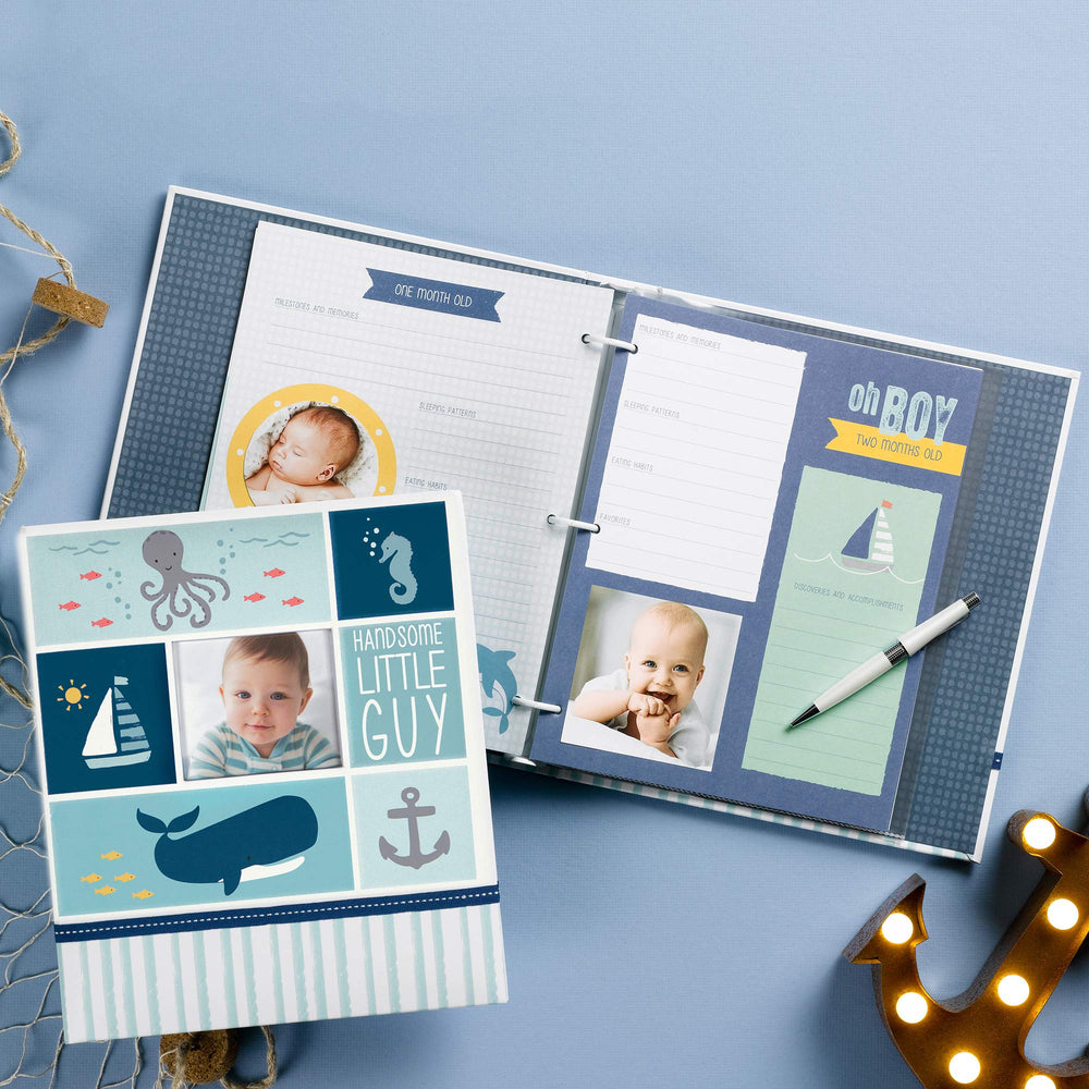 Carters Blue Nautical Memory Book homecoming page records milestones for early years.