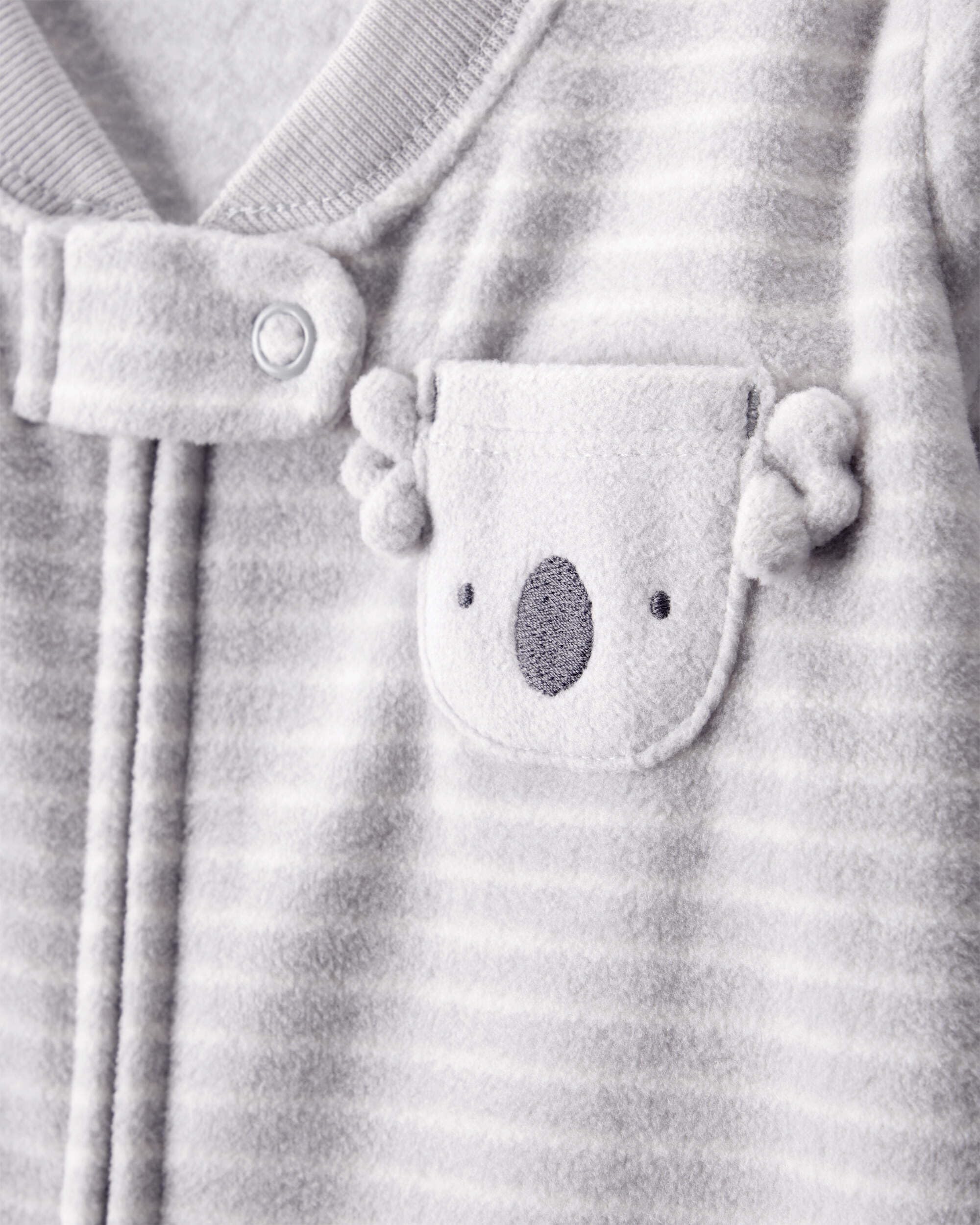 Carter's sleep bag double-zipper design eases diaper changes without waking baby.