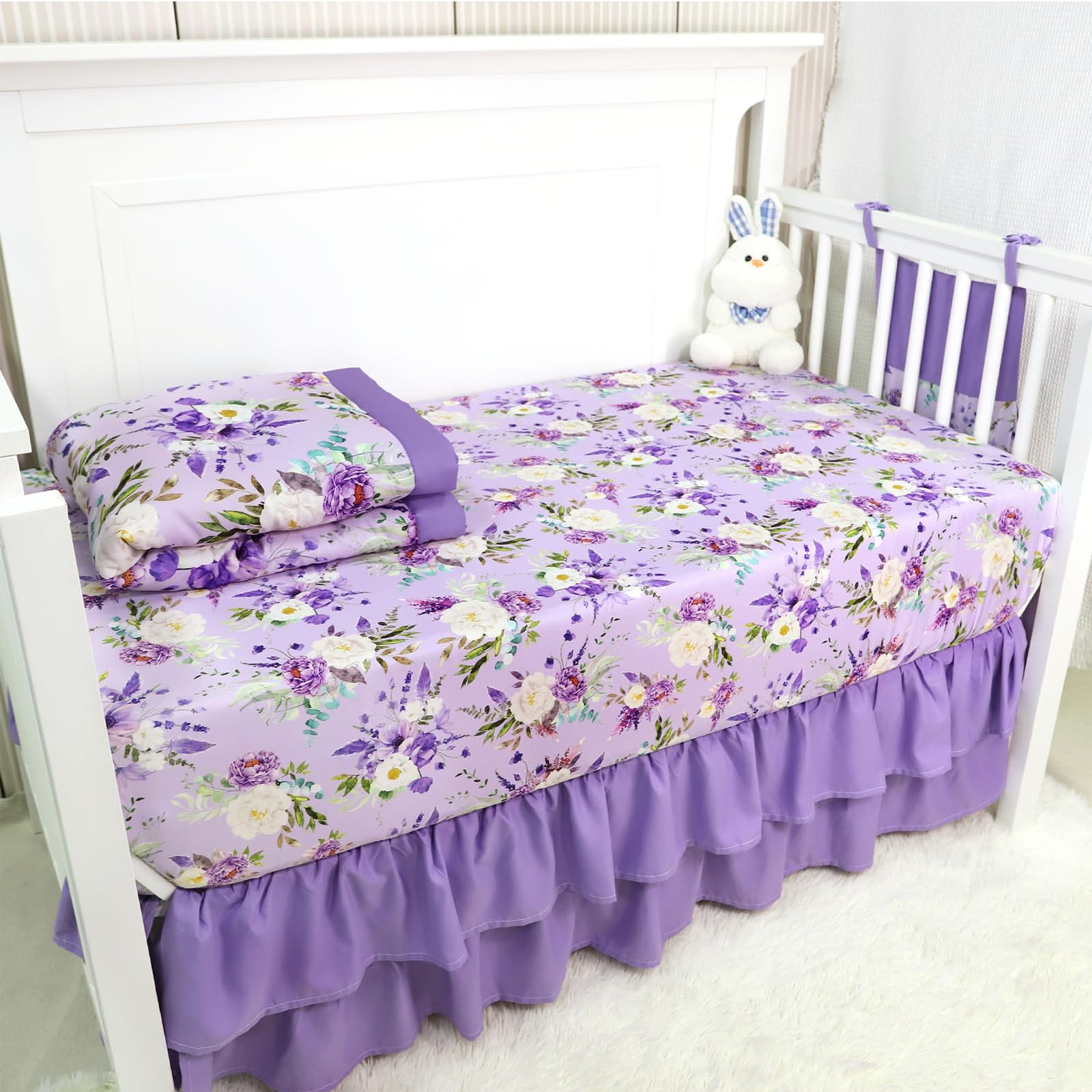 CARUILI baby nursery decor tone complements purple floral theme beautifully.