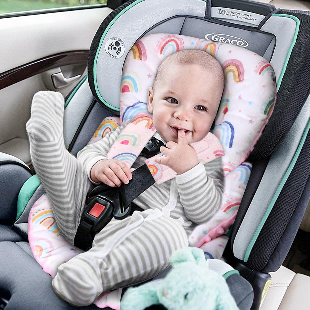 CARUILI head-support cushion pink dots keeps baby's head aligned during car trips.