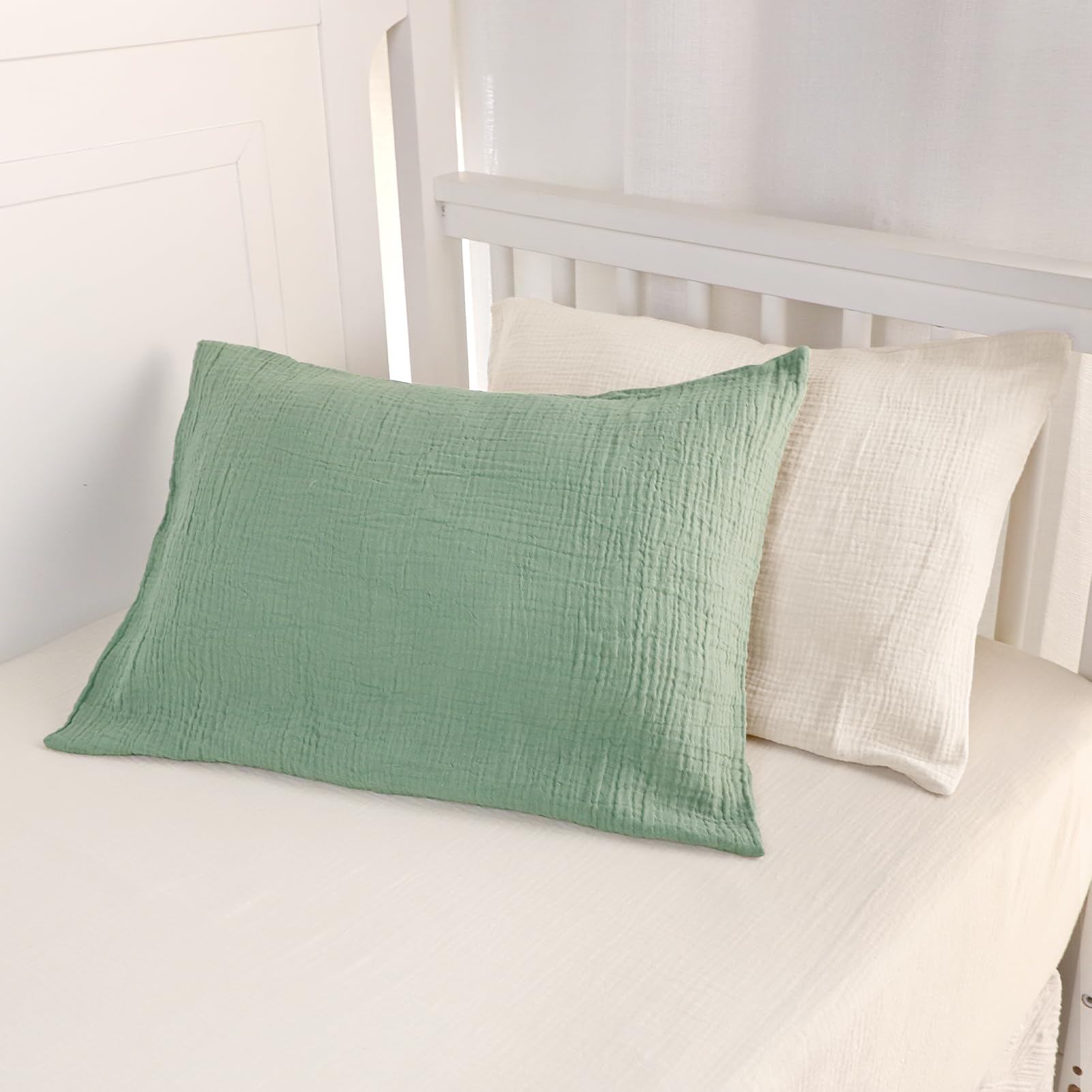 CARUILI muslin toddler pillowcase apricot-green set shown on a pillow, ideal for cozy kid-friendly bedrooms