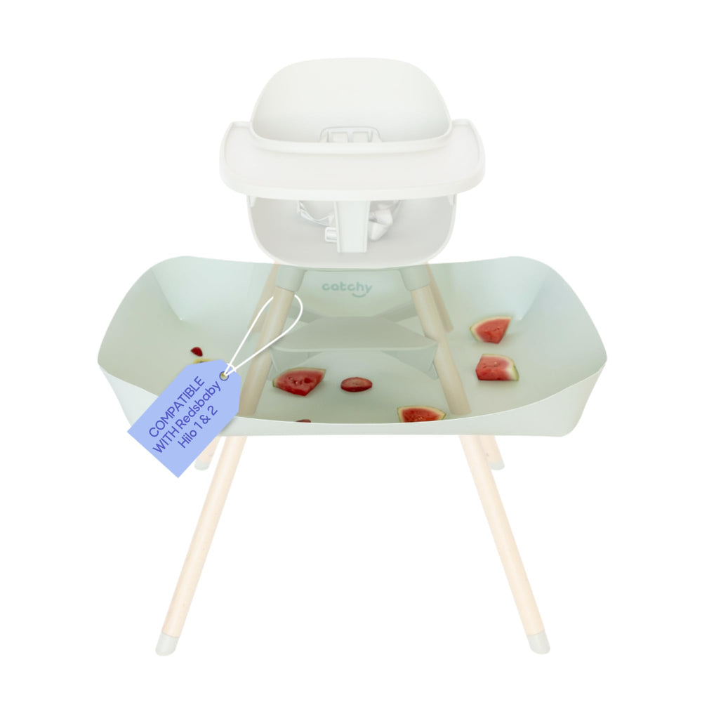 Catchy Food Catcher on high chair setup reduces dropped food mess during meals.