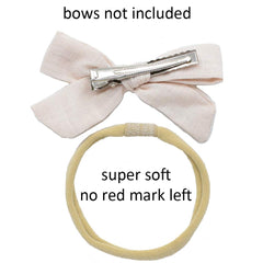 Catin headbands high-stretch test demonstrates growing-fit from newborn to kids.