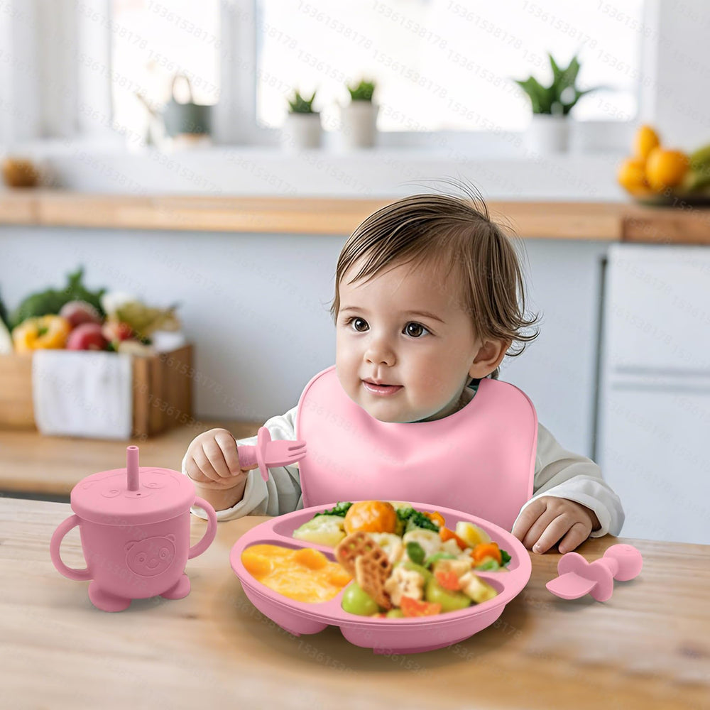 Catvegue mini silicone spoon and fork in pink for tiny hands and gentle texture exploration.