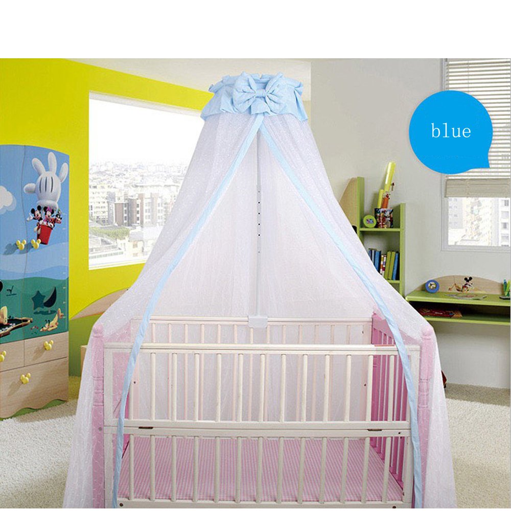 CdyBox crib net blue draped over a cradle creates a cozy canopy.