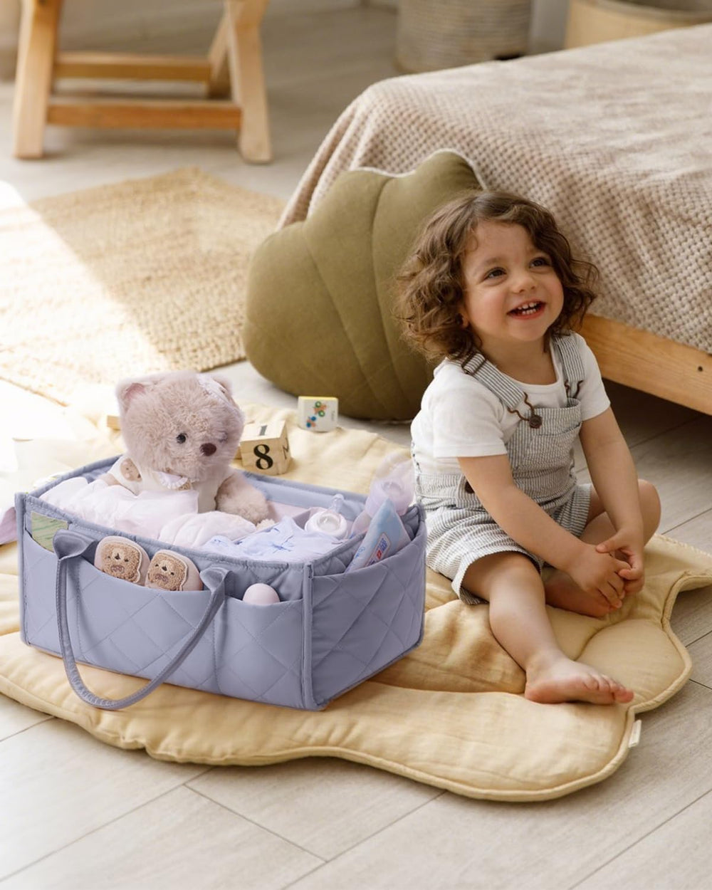 CEI-CEI diaper caddy shows eight external pockets for quick pacifier and wipe access.