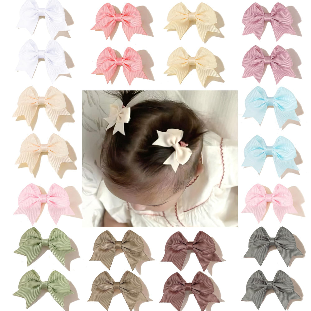 CellElection baby hair bow clips closeup demonstrates gentle hold for fine hair.