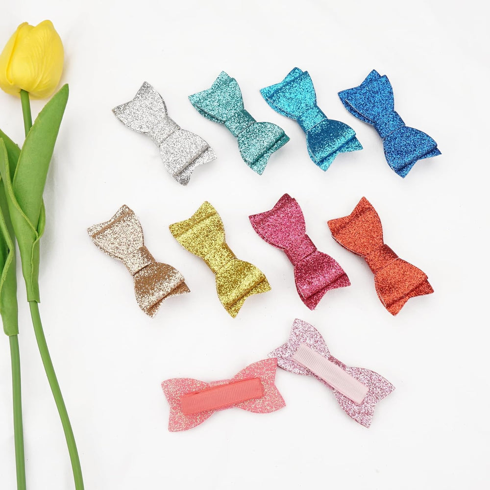 CellElection glitter bow close-up shows durable clips for secure hold on hair