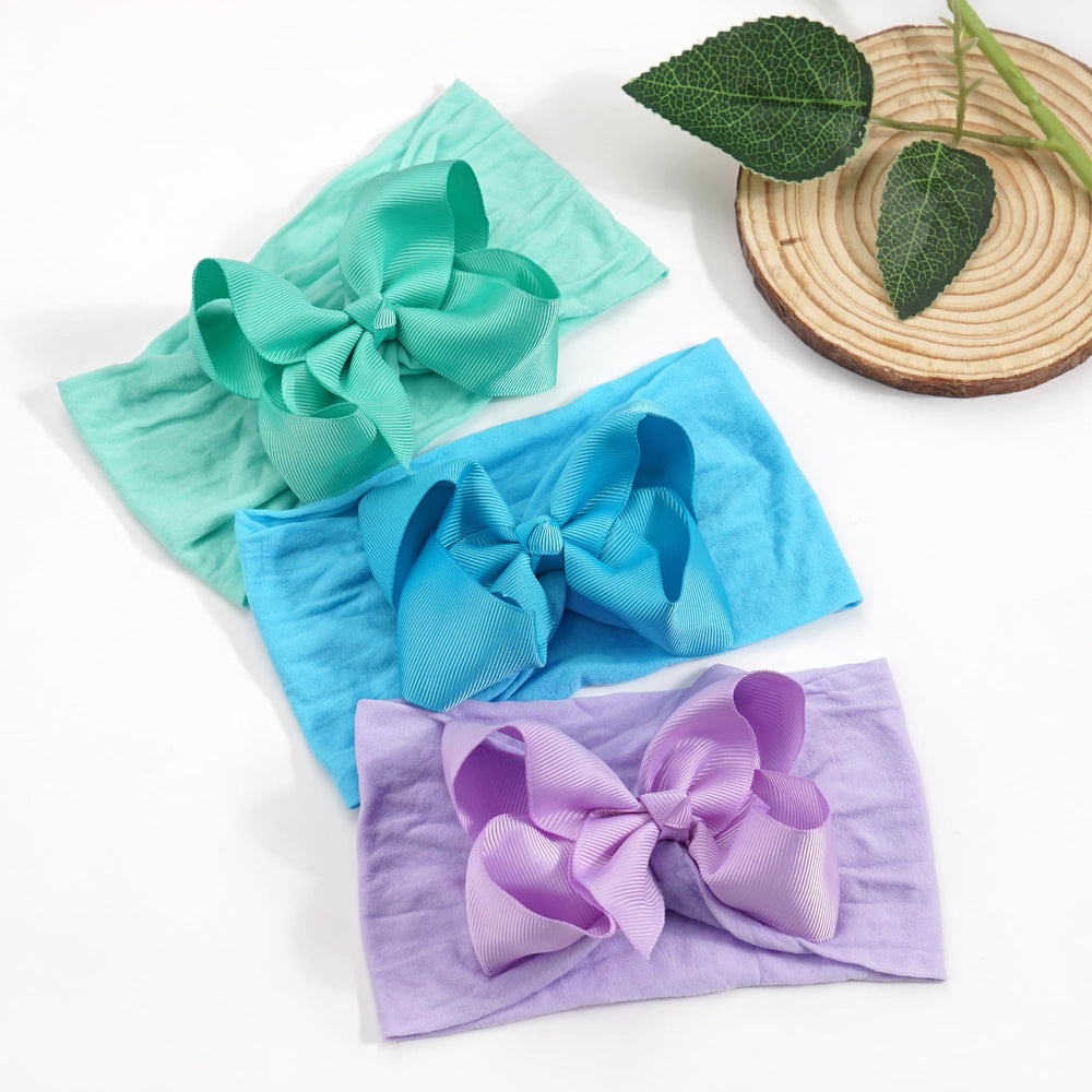 Celllot baby bow with grosgrain detail for a classic, durable look.