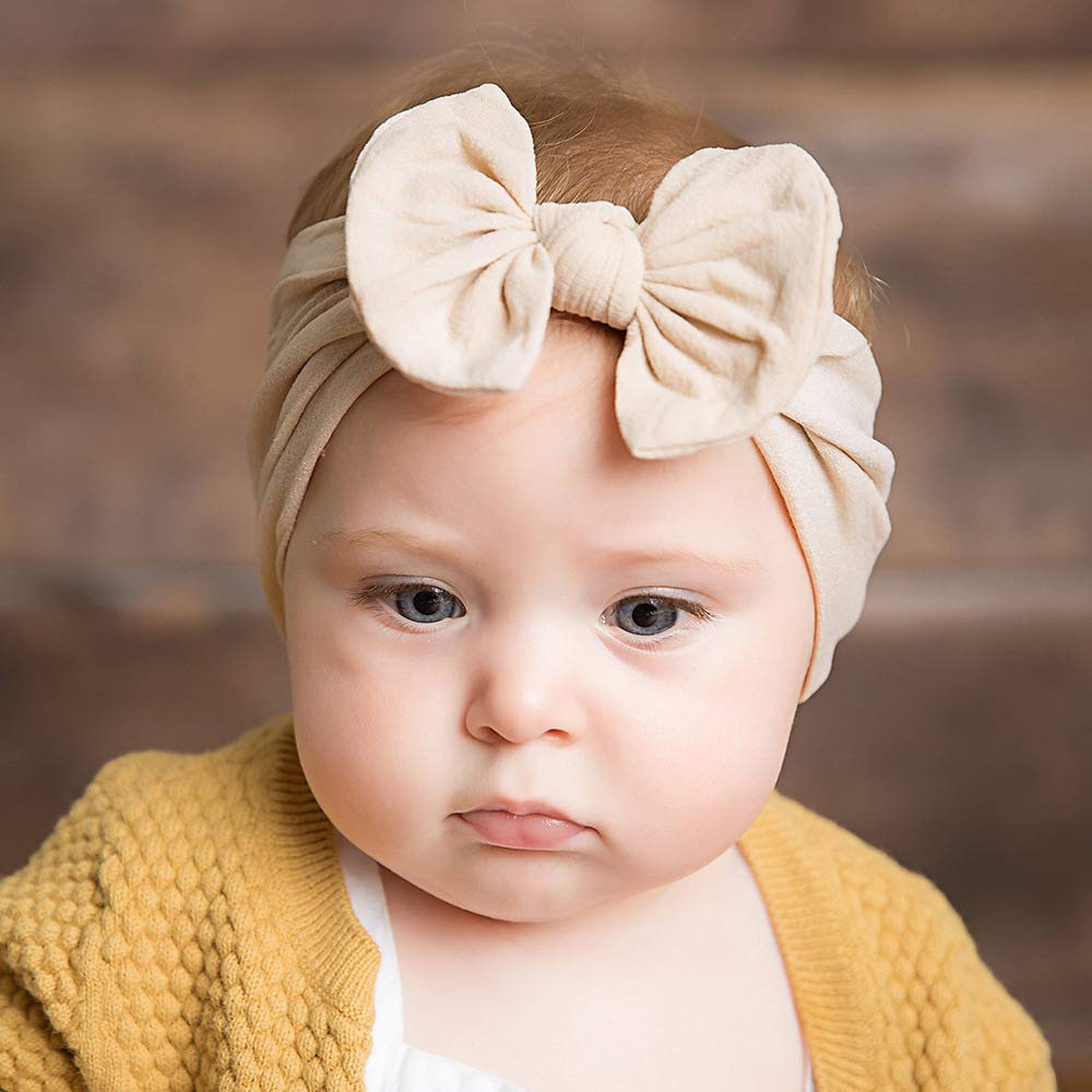 CÉLLOT baby shower photoshoot-ready headbands in a staged setup.
