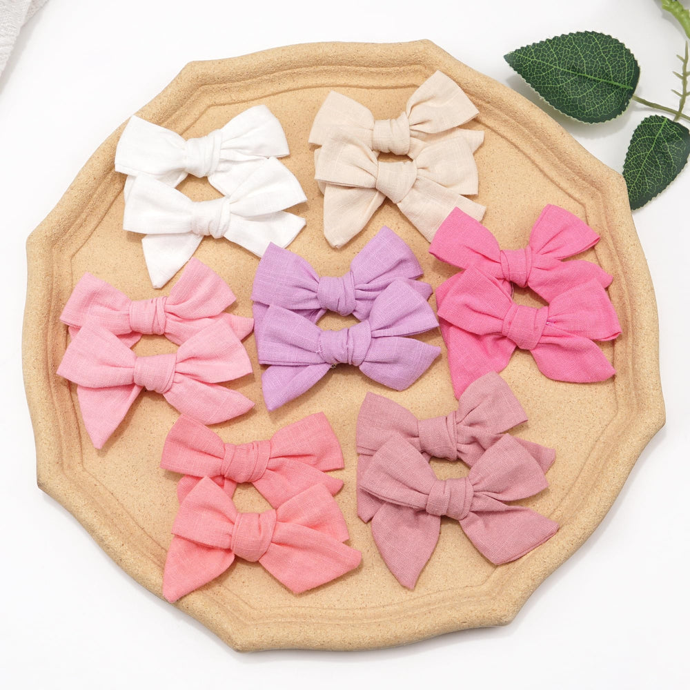 CÉLLOT bows with removable clips for two styling directions.