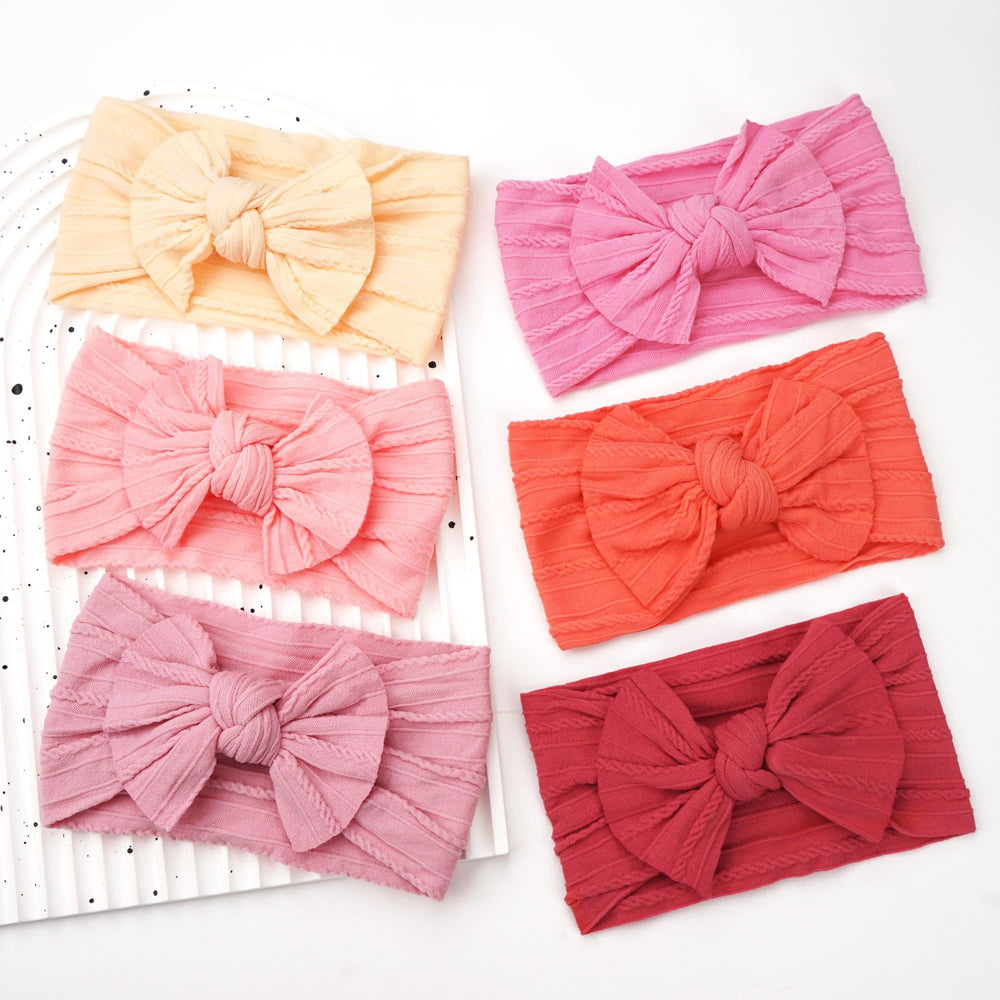 CÉLLOT colorful headbands with bows; complements outfits for many occasions.