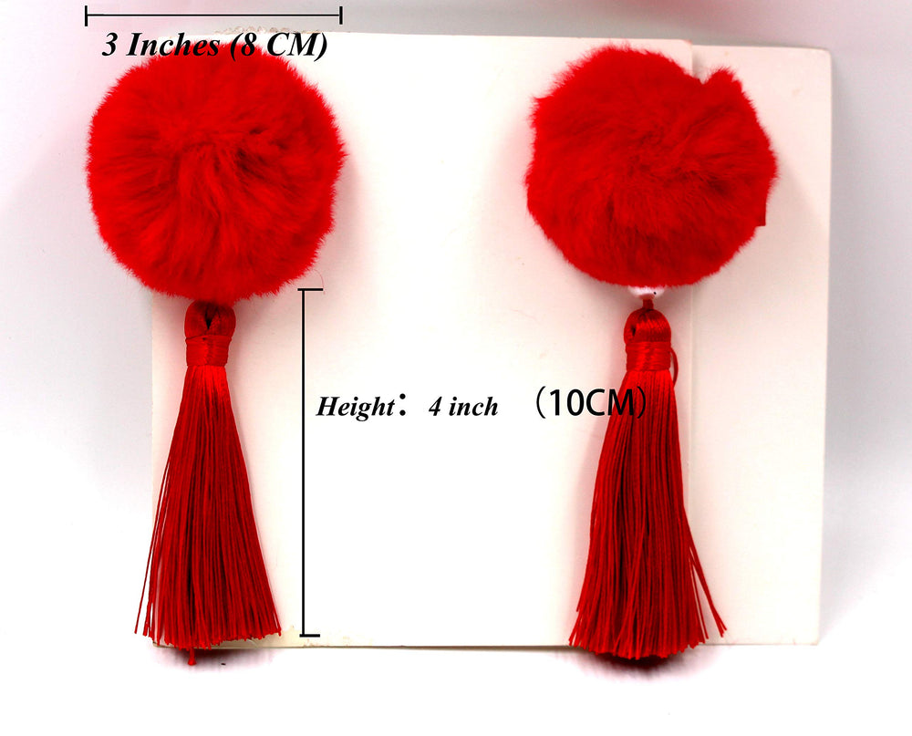 CÉLLOT pom-pom bow tassels highlight playful look and easy dress-up use