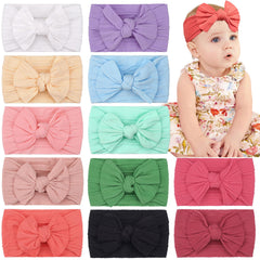 CÉLLOT super stretchy knot headband with bows for newborns; soft, secure wear.