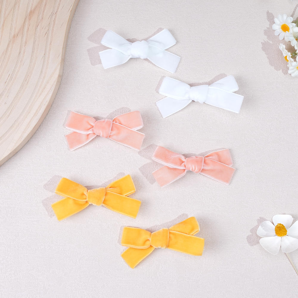 CÉLLOT Velvet Bow fully lined clip detail protects hair