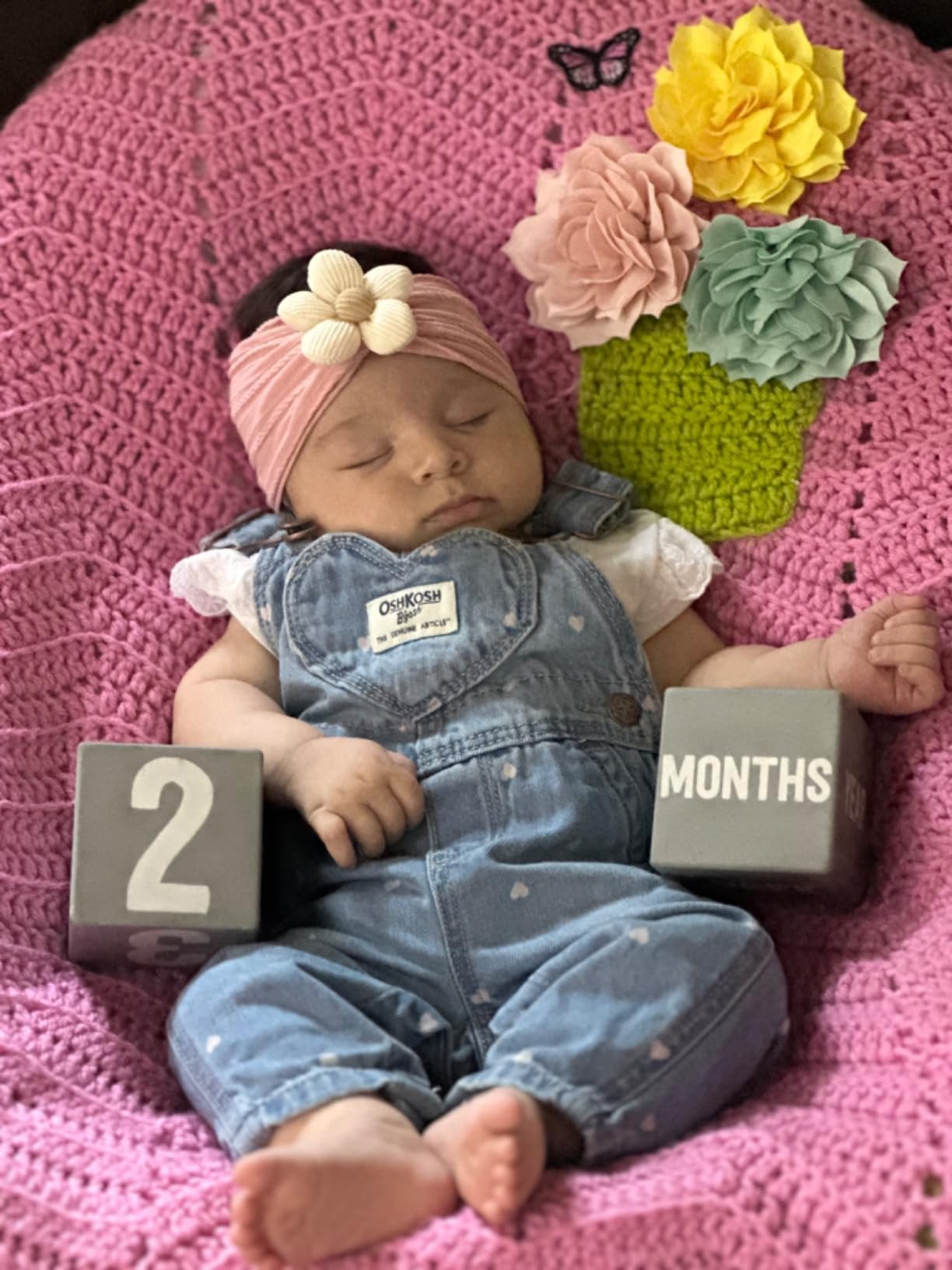 CÉLLOT baby headband on infant during playful moment