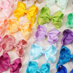 Cellot bow headbands in 40 colors help match outfits for any occasion.